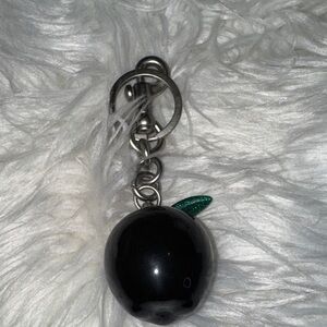 Black Apple Keychain with Green Leaf
